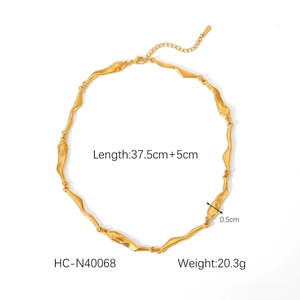Irregular gold necklace detail with dimensions 37.5cm plus 5cm length and 0.5cm width