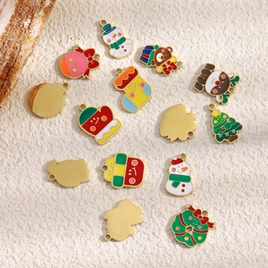 Close-up of assorted enamel Christmas charms with gold plating for DIY jewelry