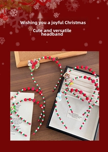 Detailed view of handmade Christmas headbands with beads, snowmen and festive charms