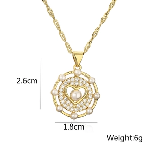 Gold round pendant with heart design and pearls showing dimensions 2.6cm by 1.8cm and 6g weight
