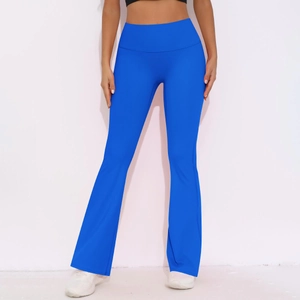 Detail of high waist bright blue yoga pants with flared hem and push-up effect