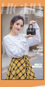 Glossy black mini silicone jelly bag with gold circular buckle and elegant top handle