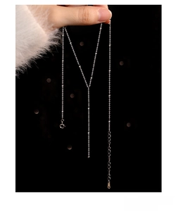 Detailed view of S925 sterling silver beaded tassel necklace with a polished finish
