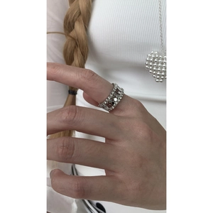 Macro view of silver honeycomb ring with geometric hexagon design and zircon inlay