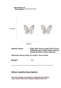 Detailed view of butterfly earrings with silver pins, beads and fine zircon inlaying