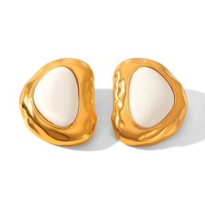 Detail of 18k gold irregular earrings with white resin droplets in a vintage style