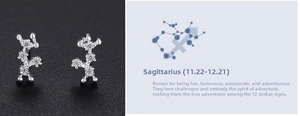 Macro view of 999 sterling silver Sagittarius zodiac stud earrings with cubic zirconia