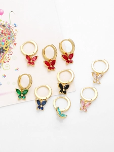 Detail of elegant gold butterfly earrings set with vibrant multi-colored zircon stones