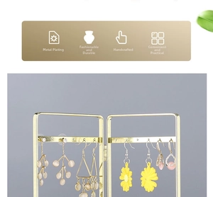 Detailed view of foldable golden iron earring display rack with various jewelry styles