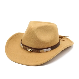 Khaki wool felt cowboy hat with leather band, shell buckle, and tassel detail