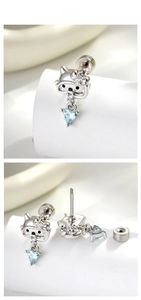 Detail of silver cat stud earrings with blue heart zircon and secure screw back