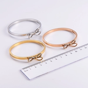Detailed size comparison of stainless steel bow bracelets in silver, gold and rose gold