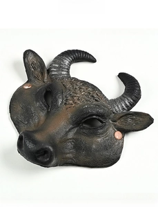 Macro shot of realistic bull mask featuring curved horns and detailed skin texture
