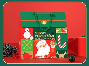 Detail of Christmas gift box featuring Santa Claus illustrations and green rope handles