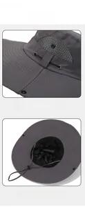 Detail of dark grey sun hat featuring breathable mesh lining and adjustable chin strap