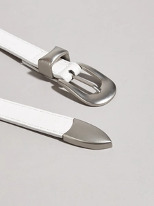 Close-up of white leather belt with polished silver metal buckle and decorative tip