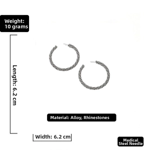 Detail showing 6.2cm oversized rhinestone hoops with anti-allergic medical steel pins
