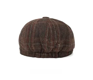 Rear view of a dark brown checkered wool newsboy cap with detailed woven texture