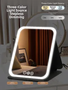 Detail of portable LED makeup mirror showing tri-color light modes and touch dimming control