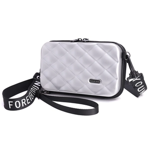 Silver PC hardshell crossbody bag with diamond pattern and Forever Young strap