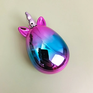 Close-up of cute unicorn hairbrush with metallic pink and blue gradient finish