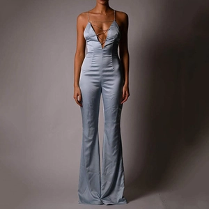Sexy light blue satin halter jumpsuit with deep V-neck and decorative gold chains