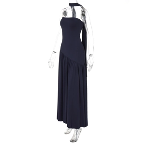 Detail view of navy strapless dress featuring an elegant neck ribbon and side slit design