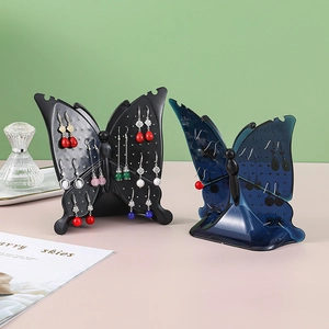 Butterfly jewelry display stand for earrings and necklaces in black and blue acrylic