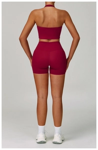 Rear view of wine red seamless yoga set featuring halter sports bra and high waist shorts