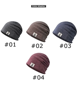 Detail display of knit beanies in dark grey, light coffee, navy blue, and wine red