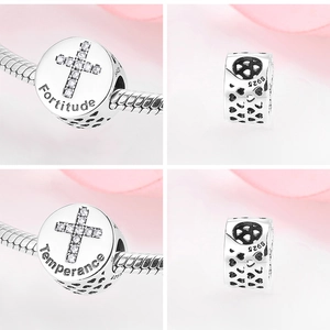 Detail of S925 sterling silver charm with Fortitude engraving and zircon cross inlay