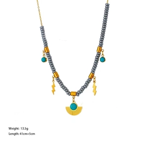 Bohemian beaded necklace with golden lightning bolt and fan-shaped metal charms