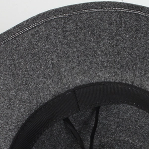 Macro shot of dark grey fedora showing brim stitching and black grosgrain sweatband