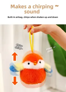 Détail d'un porte-clés oiseau en peluche orange avec bruiteur sonore intégré