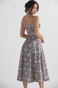 Close-up of the vintage floral print and slim-fit waist on this elegant summer dress