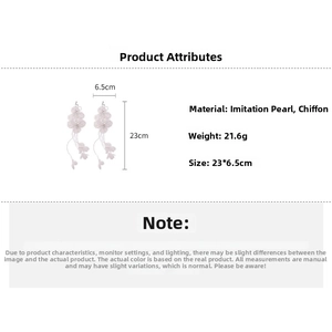 Detail view of white chiffon flower petal tassel earrings with 23cm length and 6.5cm width