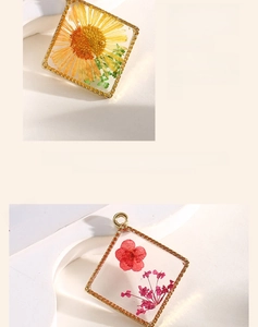 Detailed macro view of square resin pendants with dried sunflowers and gold alloy borders