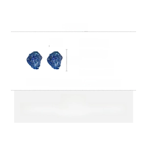 Detail view of blue irregular resin earrings with silver needles and size measurements