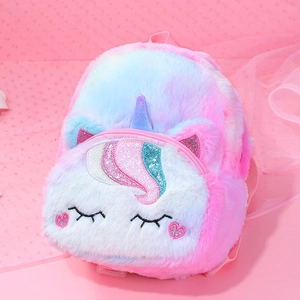 Close-up of fluffy pink unicorn backpack with sequin horn and soft plush texture detail