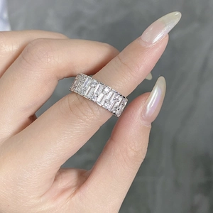 Macro shot of silver S925 sterling silver band ring with sparkling cubic zirconia inlay