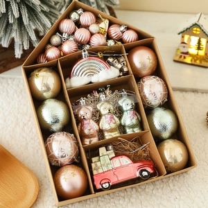 Christmas ornaments set featuring a red truck and festive shapes in a gift box