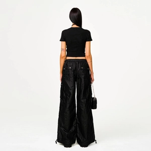 Streetwear look featuring black oversized cargo pants and slim T-shirt from a back view
