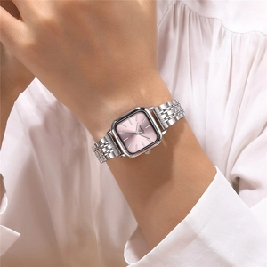 Close-up of women's silver square watch with sunray pink dial on a model wrist