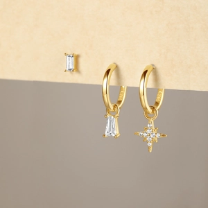 Close-up of S925 silver gold earrings with zircon star and rectangle charms