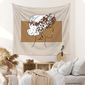 Detail of minimalist bohemian tapestry featuring a female profile with leaf crown