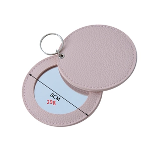 Pink portable PU leather mini makeup mirror 8cm diameter and 29g lightweight design