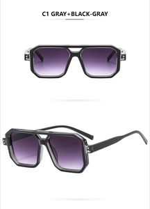 Detail view of double-bridge aviator sunglasses with gray gradient lenses and rivets