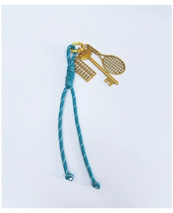 Detail of teal woven rope keychain with vintage gold abacus, key, and tennis racket charms