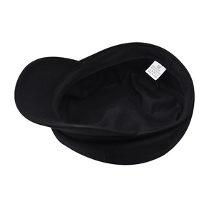 Detail shot of the inner lining and fabric care label for black newsboy cap