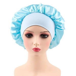 Detailed view of light blue satin sleep bonnet featuring wide elastic band on a mannequin